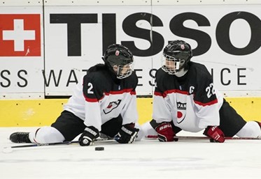 PREROV, CZECH REPUBLIC - JANUARY 11: Japan's Akane Shiga #2 and Aoi Shiga #22 stretch during warm-ups prior to  relegation round action against Switzerland at the 2017 IIHF Ice Hockey U18 Women's World Championship. (Photo by Steve Kingsman/HHOF-IIHF Images)

